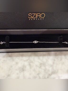 Evil Eye Bracelet 14k solid white gold and diamonds with sapphire